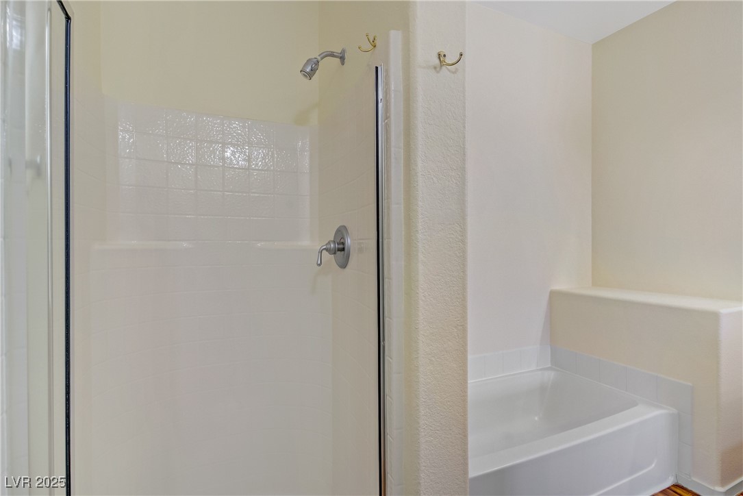 2291 West Horizon Ridge Parkway, Unit 11266 Henderson, NV 89052 - Photo 31 of 40 Bathroom with a garden tub and a stall shower