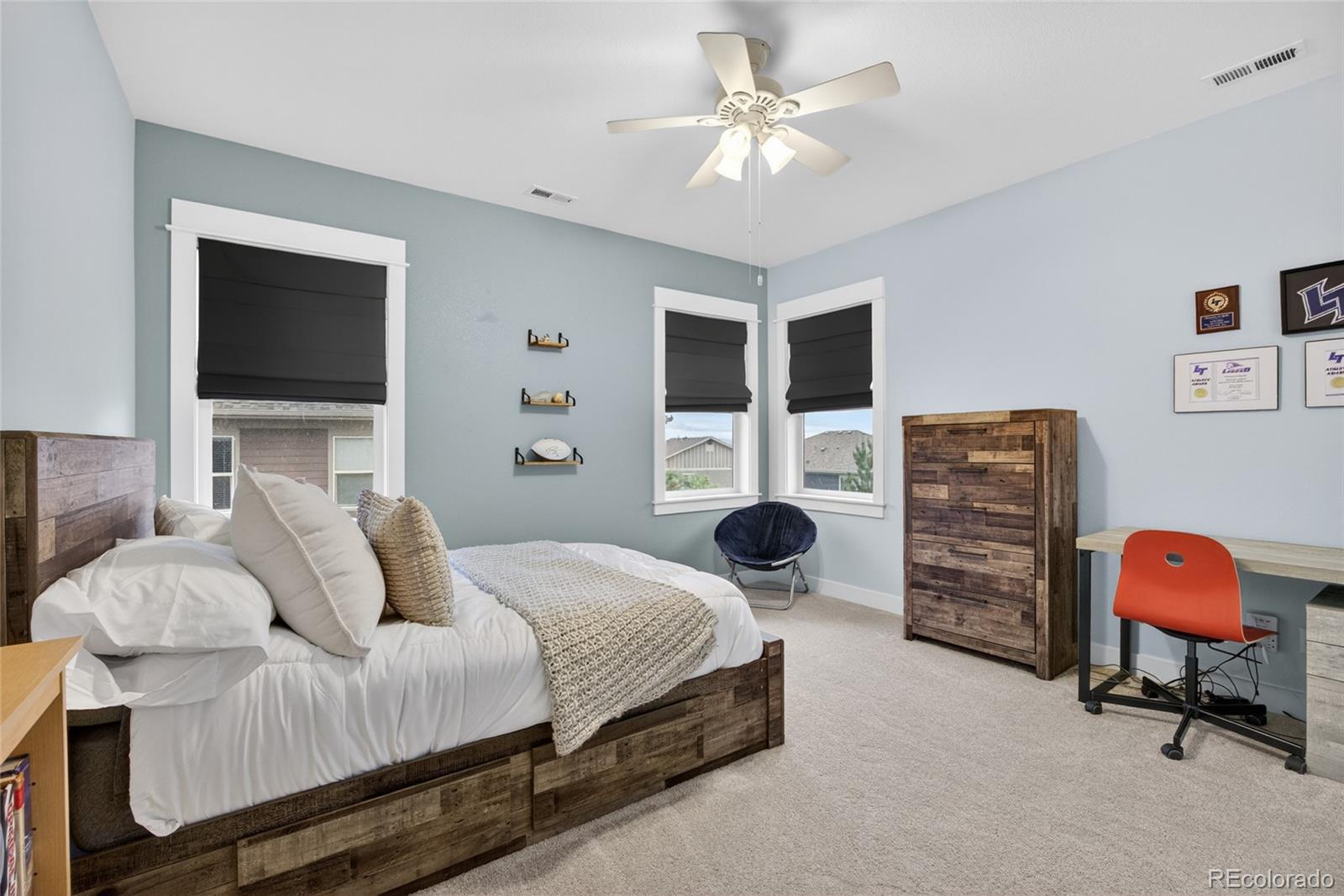 20554 East Shady Ridge Road Parker, CO 80134 - Photo 27 of 49 a bedroom with a bed and dresser