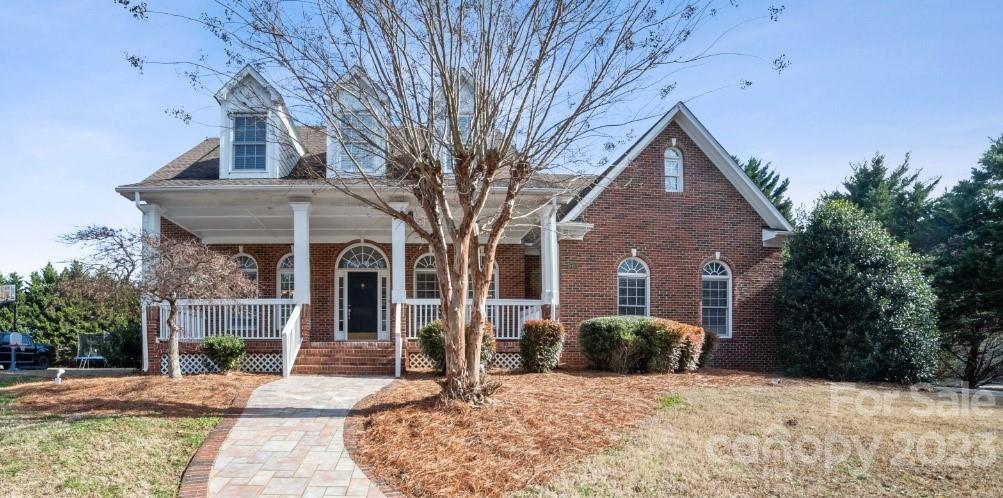 8403 Royster Run Waxhaw, NC 28173 - Photo 1 of 25 a front view of a house with a large tree