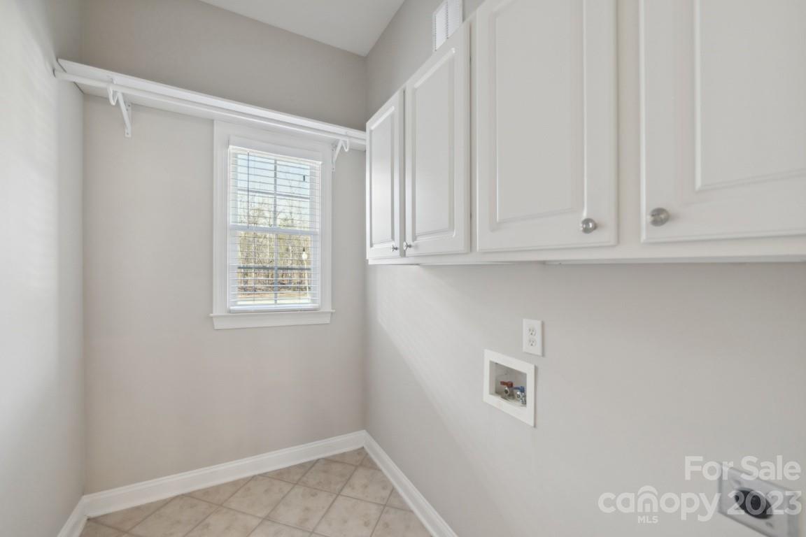 8403 Royster Run Waxhaw, NC 28173 - Photo 11 of 25 a view of kitchen with wooden floor and cabinet
