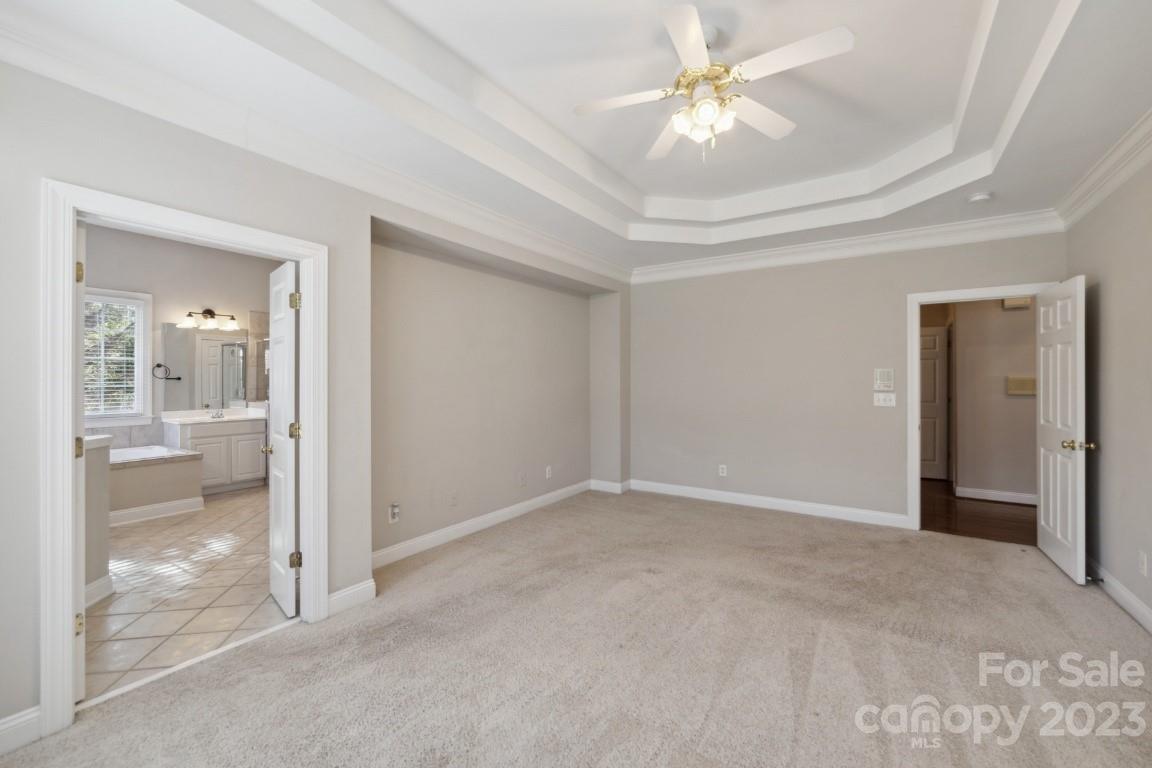 8403 Royster Run Waxhaw, NC 28173 - Photo 13 of 25 a view of a room with a ceiling fan and bathroom
