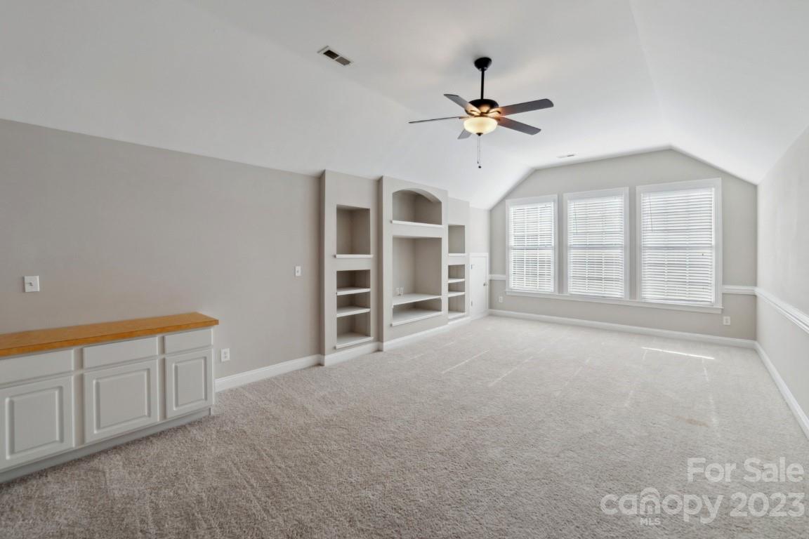 8403 Royster Run Waxhaw, NC 28173 - Photo 14 of 25 a view of an empty room with a window and kitchen view