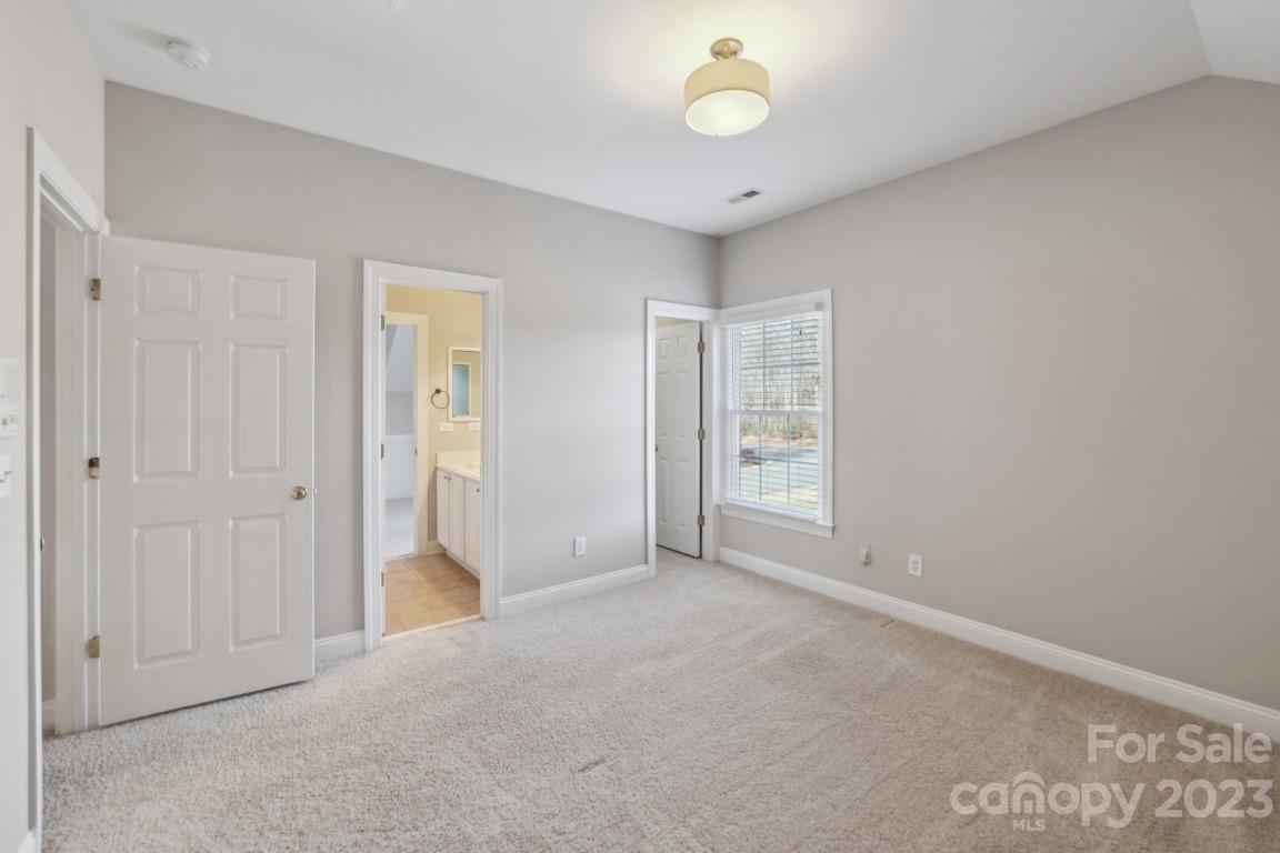 8403 Royster Run Waxhaw, NC 28173 - Photo 15 of 25 an empty room with windows and closet
