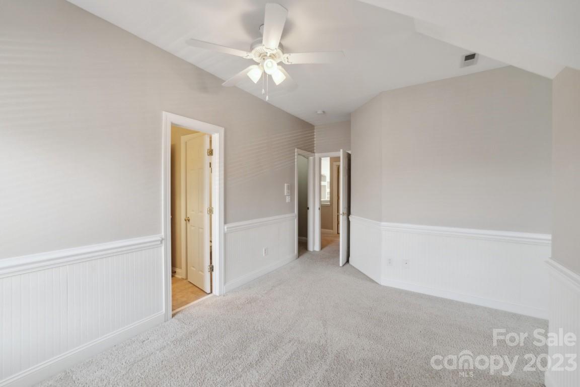 8403 Royster Run Waxhaw, NC 28173 - Photo 18 of 25 a view of a room with an entryway and chandelier fan
