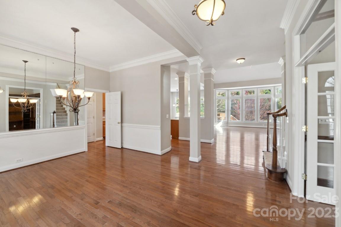 8403 Royster Run Waxhaw, NC 28173 - Photo 2 of 25 a view of a big room with wooden floor and windows