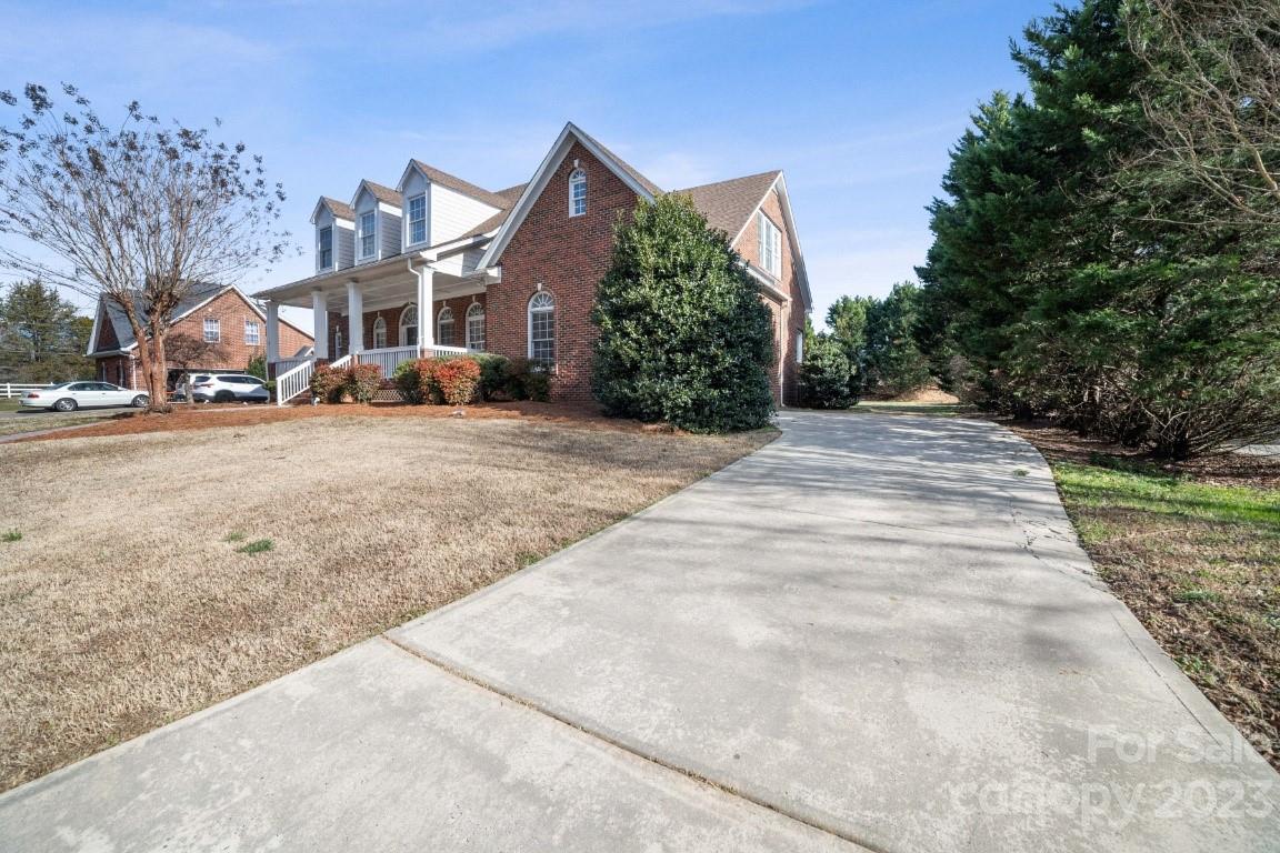 8403 Royster Run Waxhaw, NC 28173 - Photo 25 of 25 a front view of a house with a yard and garage