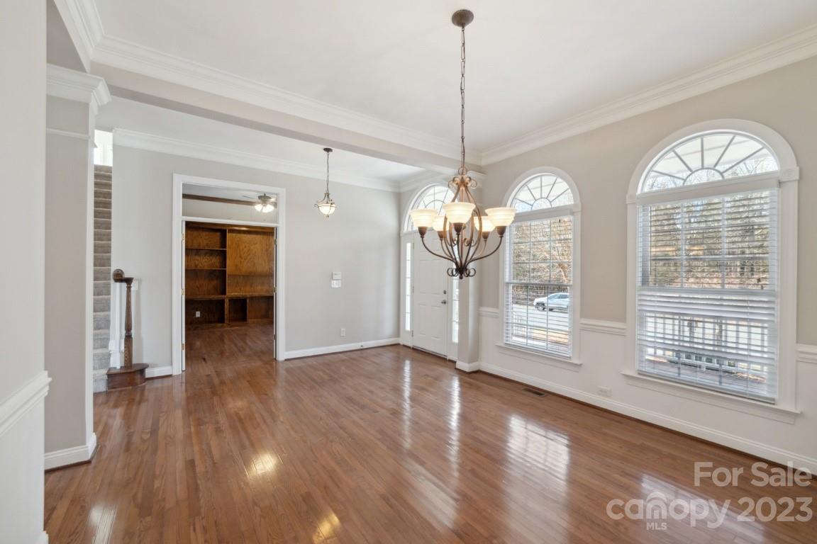 8403 Royster Run Waxhaw, NC 28173 - Photo 3 of 25 a view of livingroom with furniture wooden floor chandelier