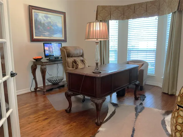 a workspace with furniture and a window