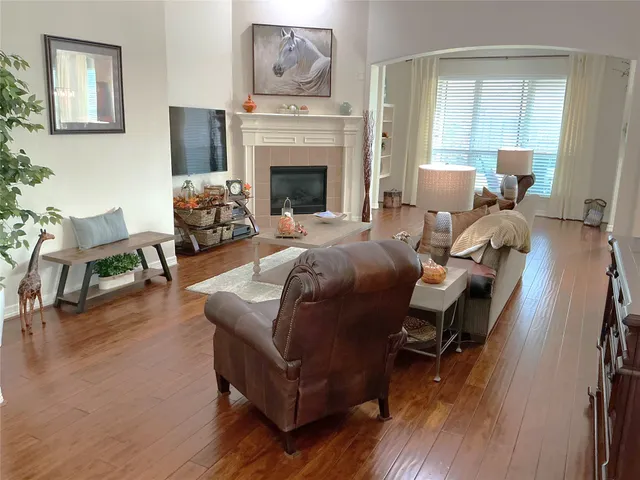 a living room with furniture or fireplace and a wooden floor