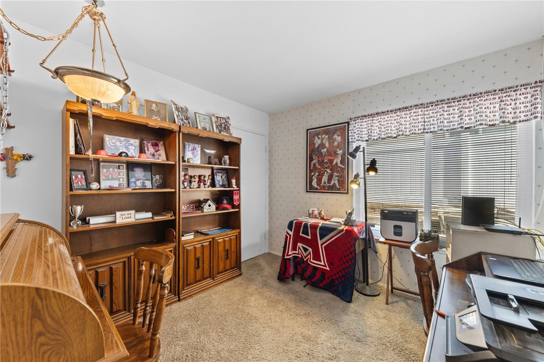 1981 Chevy Chase Drive Brea, CA 92821 - Photo 17 of 52 a livingroom with workspace bookshelf and a window