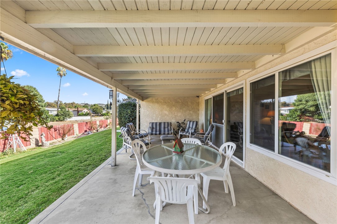 1981 Chevy Chase Drive Brea, CA 92821 - Photo 27 of 52 a patio with a table and chairs and potted plants