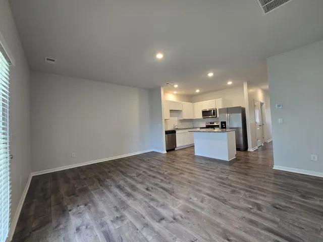 a view of kitchen with wooden floor