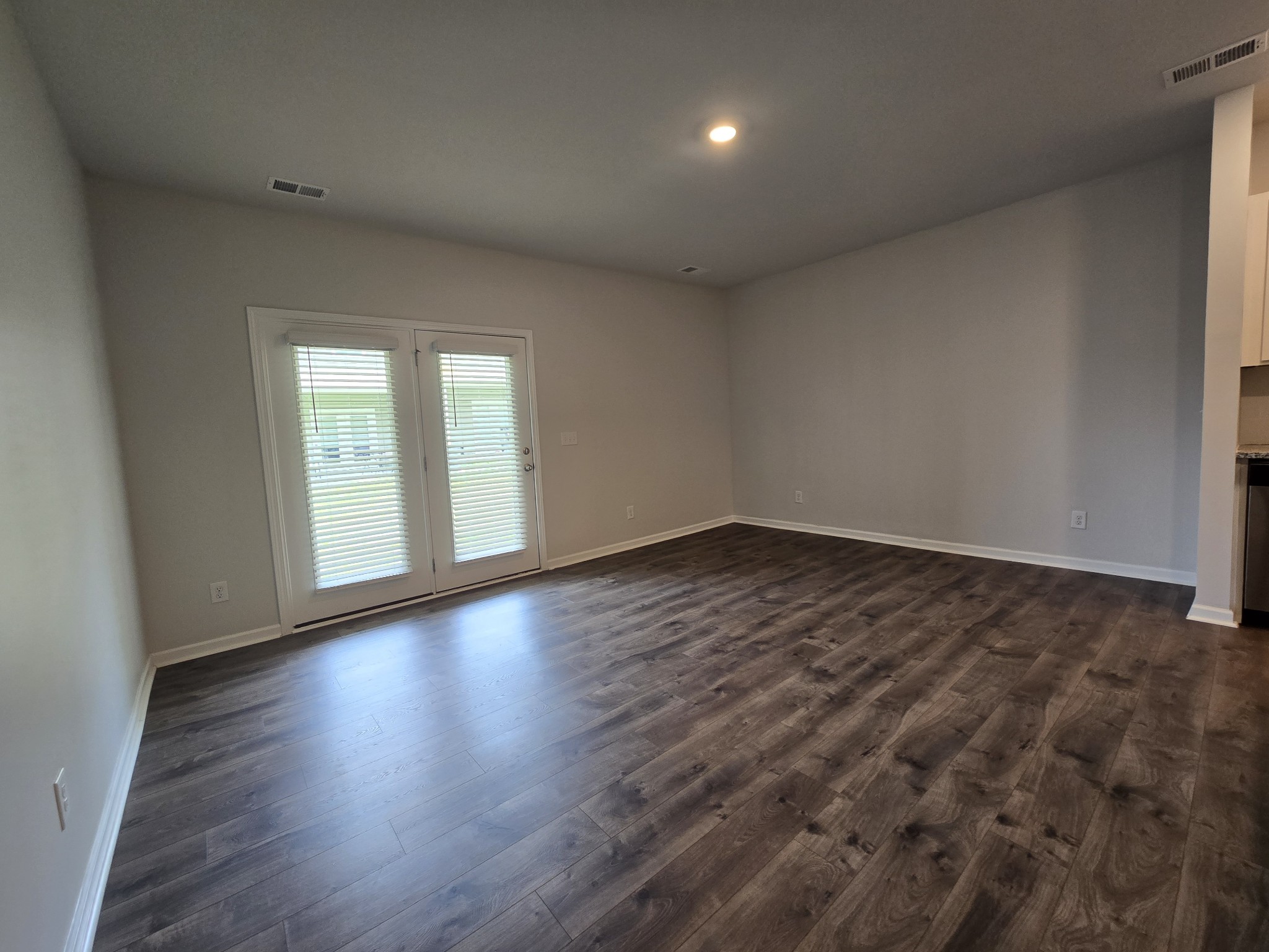 603 Clifford Heights Columbia, TN 38401 - Photo 3 of 15 a view of an empty room with wooden floor and windows