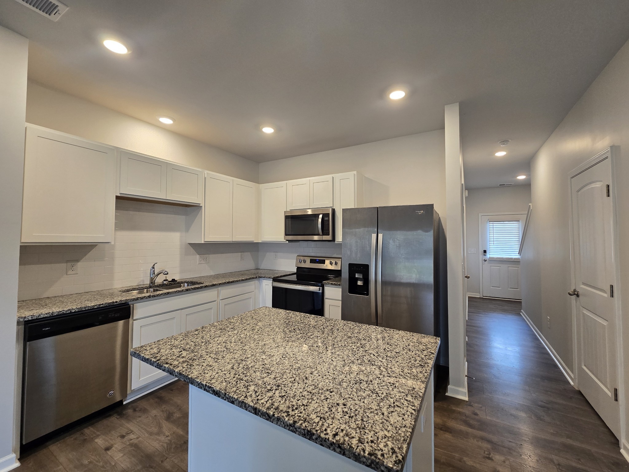 603 Clifford Heights Columbia, TN 38401 - Photo 4 of 15 a kitchen with stainless steel appliances granite countertop a sink stove and refrigerator