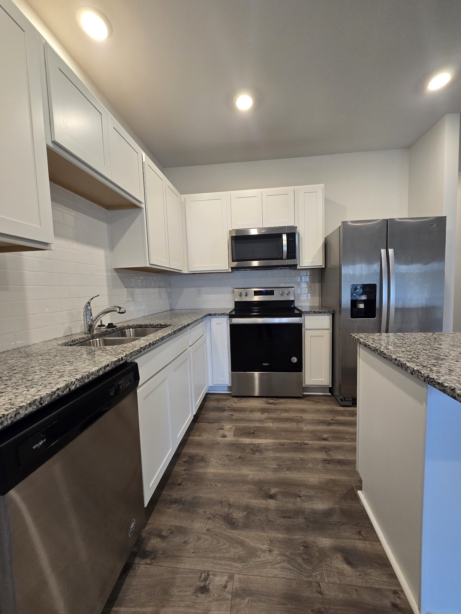 603 Clifford Heights Columbia, TN 38401 - Photo 6 of 15 a large kitchen with stainless steel appliances granite countertop a stove top oven a sink and dishwasher
