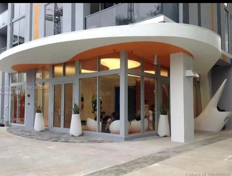 31 Southeast 6th Street, Unit 1404 Miami, FL 33131 - Photo 4 of 13 a view of a building with entrance gate