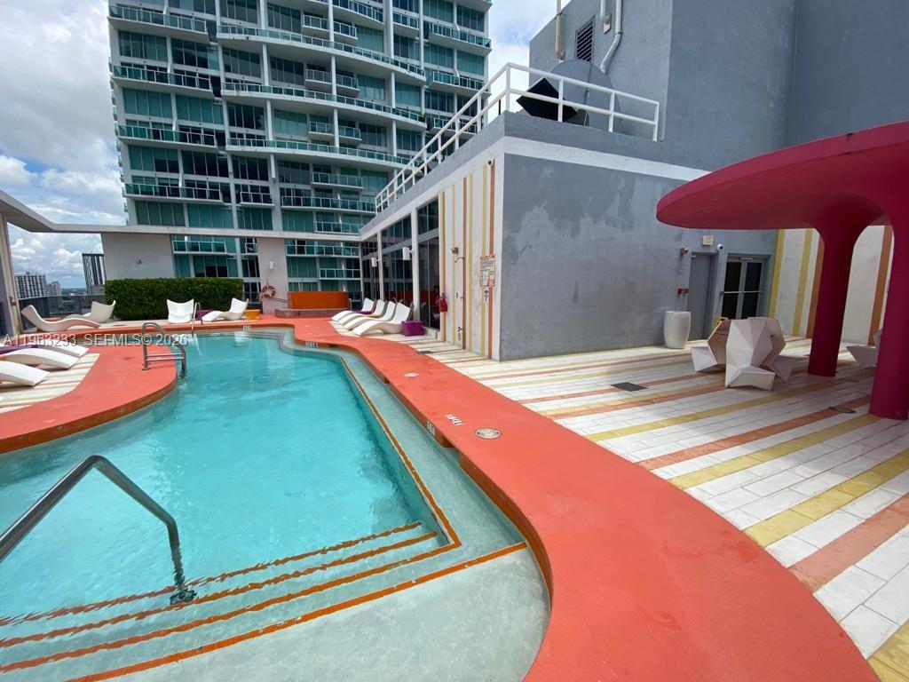 31 Southeast 6th Street, Unit 1404 Miami, FL 33131 - Photo 10 of 13 swimming pool view with a seating space and furniture