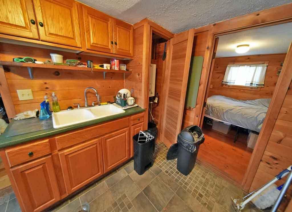 12 Stone House Drive Patten, ME 04765 - Photo 11 of 43 knotty-pine-kitchen