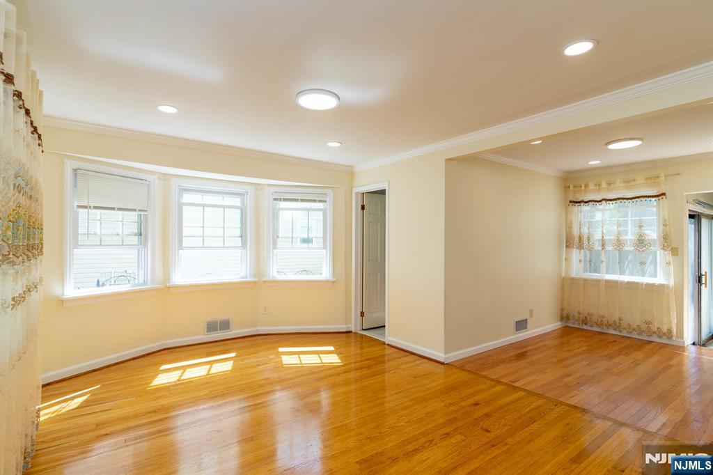 397 Hickory Avenue Paramus, NJ 07652 - Photo 3 of 14 a view of empty room with wooden floor and fan