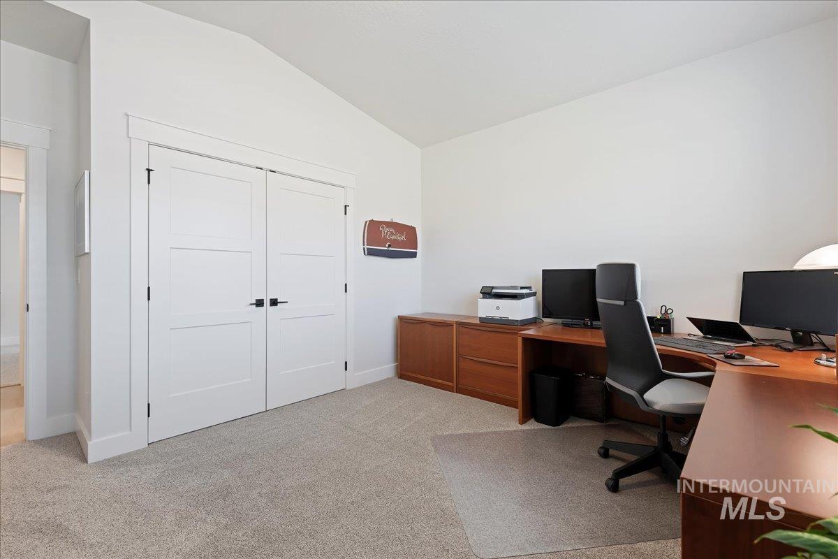 280 North Boulder Rdg Way Eagle, ID 83616 - Photo 21 of 50 Office area with vaulted ceiling and light colored carpet