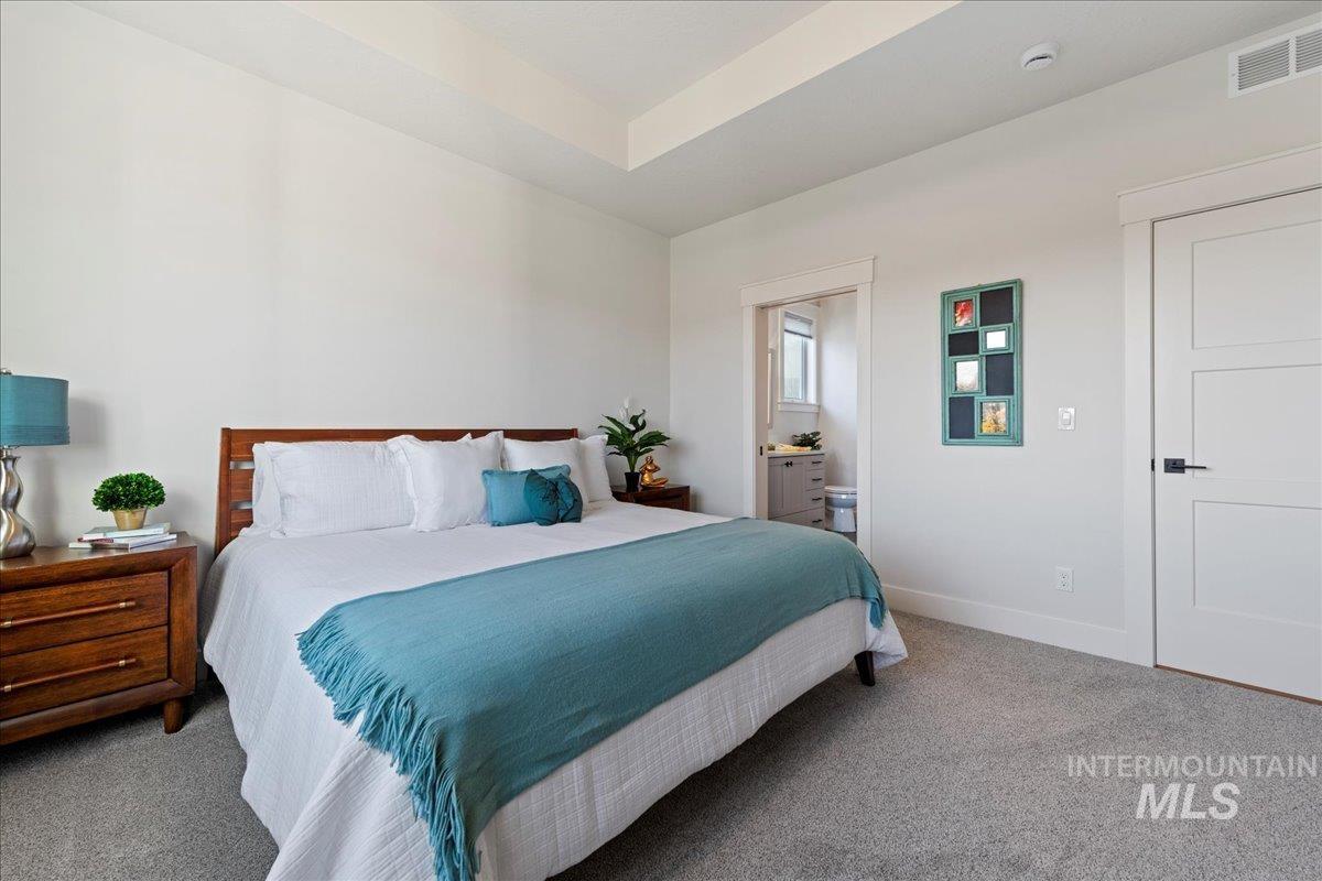 280 North Boulder Rdg Way Eagle, ID 83616 - Photo 27 of 50 Carpeted bedroom with baseboards and connected bathroom