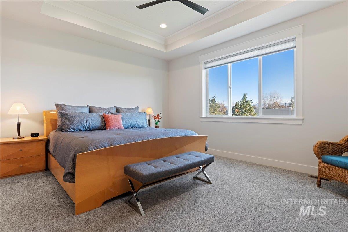 280 North Boulder Rdg Way Eagle, ID 83616 - Photo 32 of 50 Bedroom with a raised ceiling, carpet floors, ornamental molding, ceiling fan, and recessed lighting