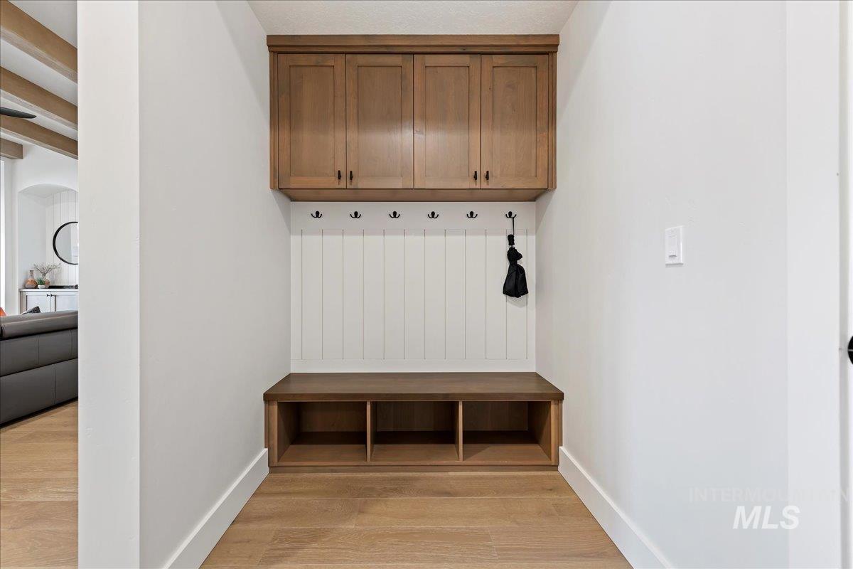 280 North Boulder Rdg Way Eagle, ID 83616 - Photo 40 of 50 Mudroom featuring light wood-style floors and baseboards