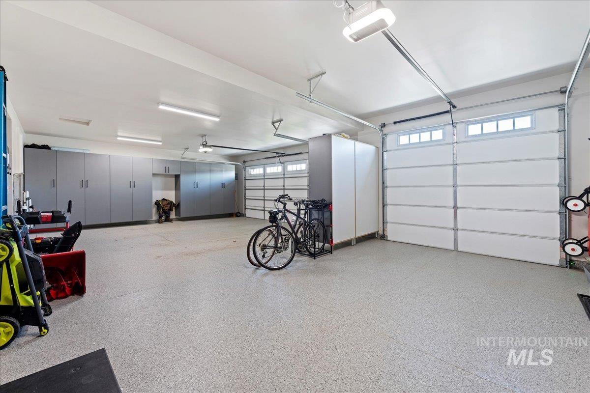 280 North Boulder Rdg Way Eagle, ID 83616 - Photo 41 of 50 Garage featuring a garage door opener