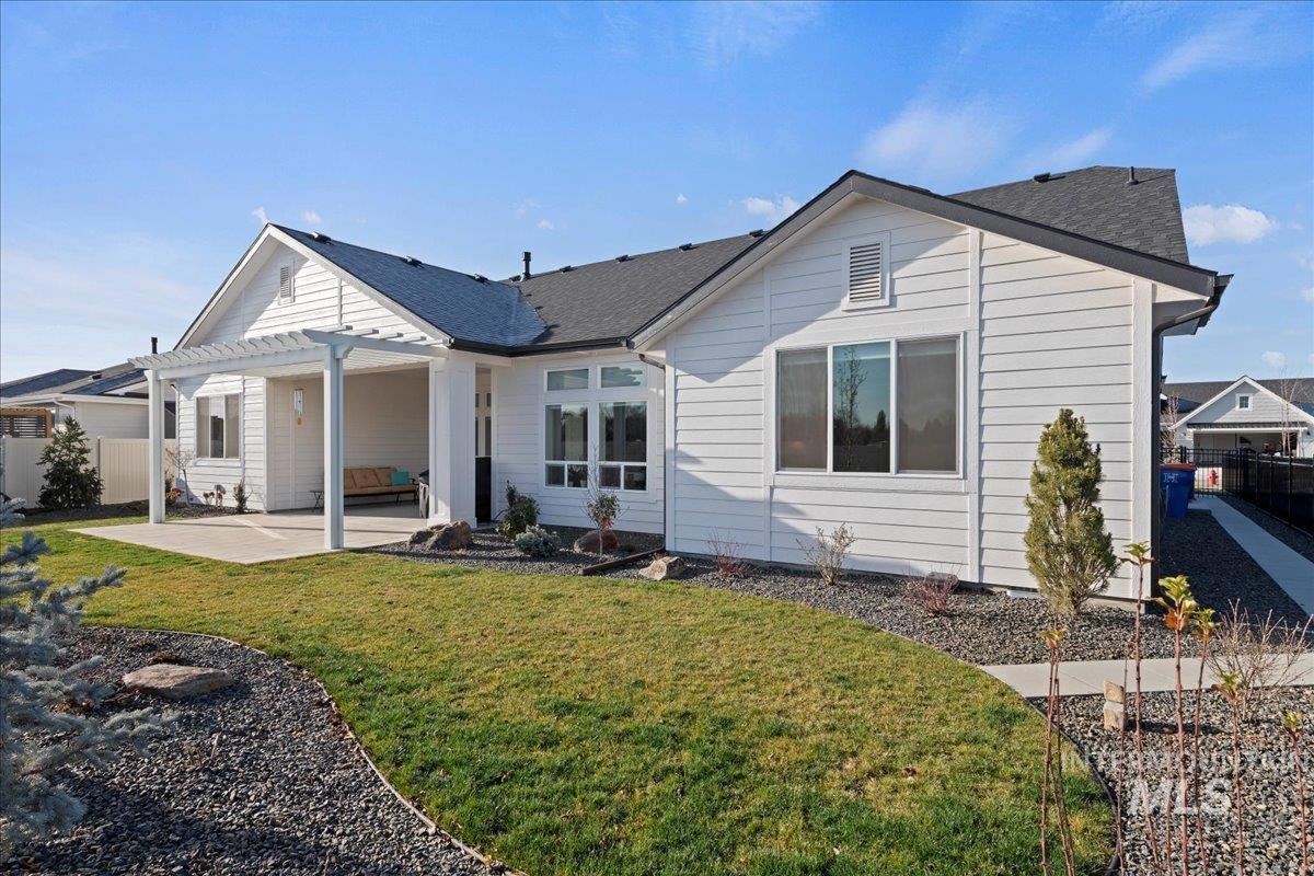 280 North Boulder Rdg Way Eagle, ID 83616 - Photo 43 of 50 Rear view of house featuring a patio area and a shingled roof