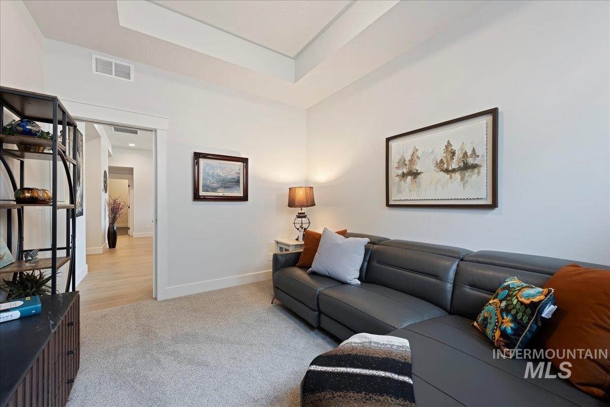 280 North Boulder Rdg Way Eagle, ID 83616 - Photo 6 of 50 Living room featuring carpet and baseboards