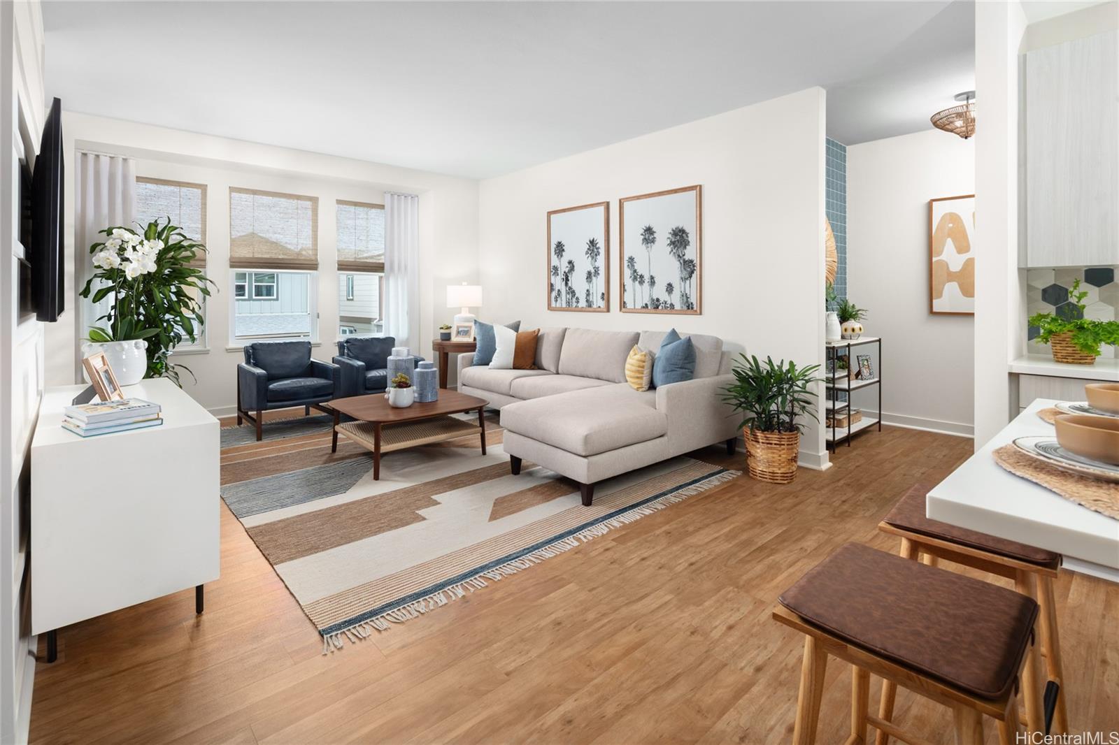 a living room with furniture rug and wooden floor