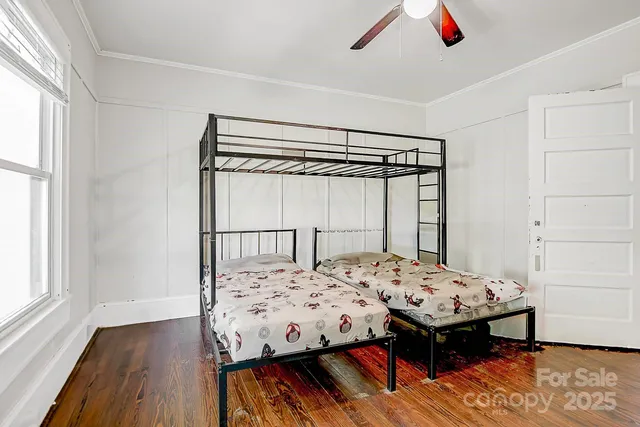 a bedroom that has a bed and a table in it