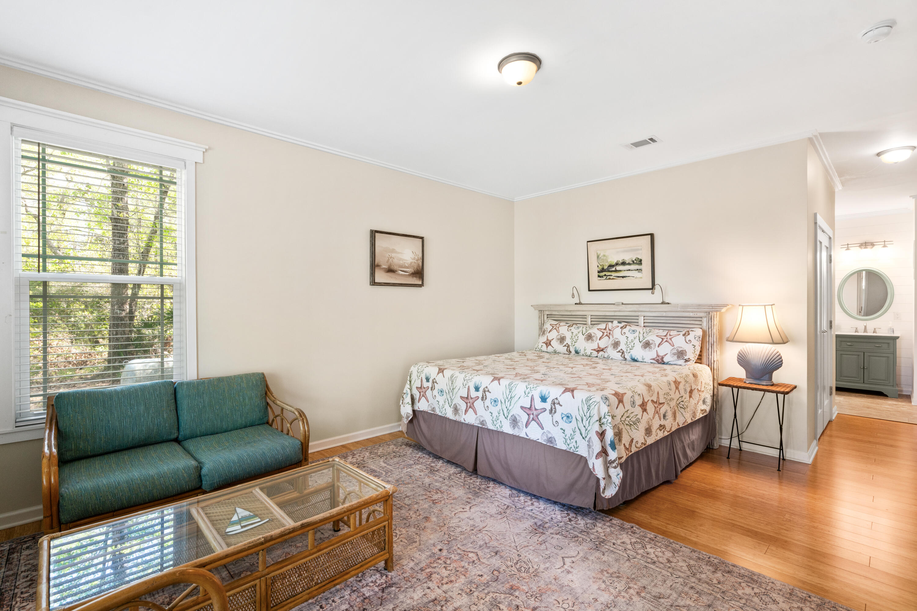 528 Bay Grove Road Freeport, FL 32439 - Photo 17 of 68 a spacious bedroom with a bed couch and a window