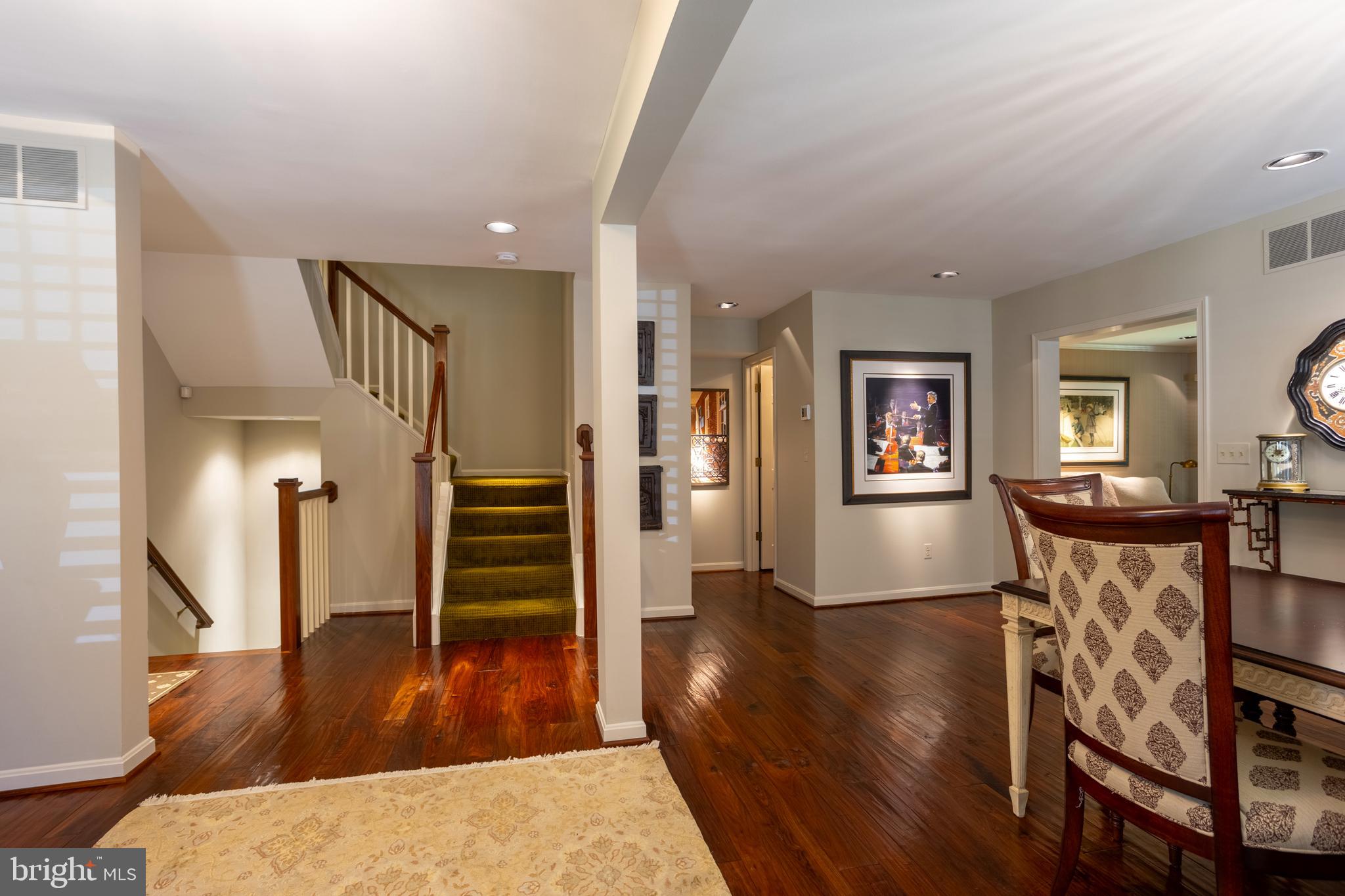 63 Raisin Tree Circle Baltimore, MD 21208 - Photo 22 of 57 a view of a livingroom with wooden floor and furniture