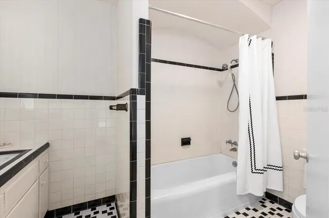 a view of an empty room and wooden floor