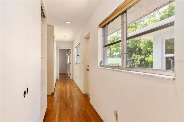 a bathroom with a granite countertop toilet a sink and a mirror