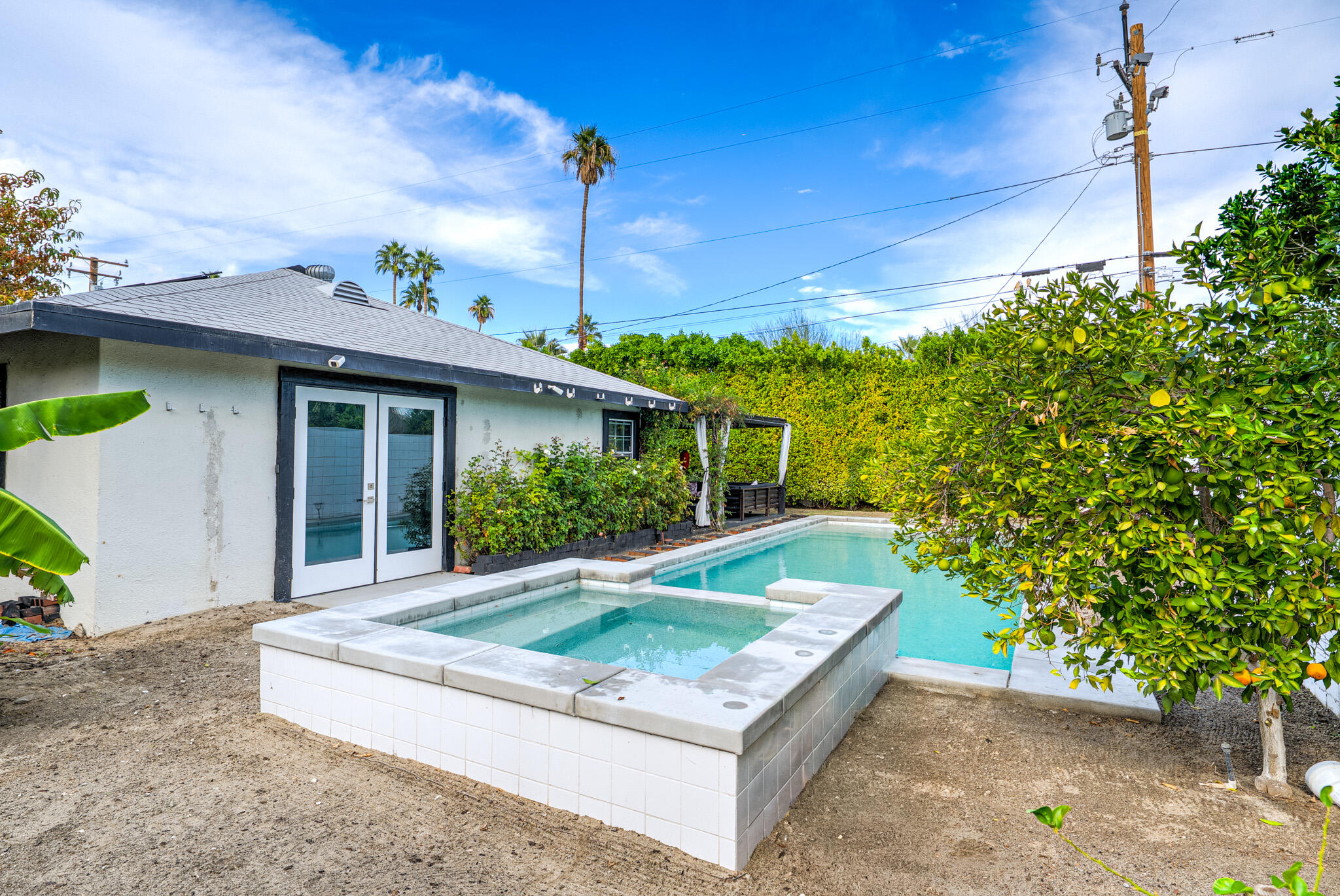 3882 East Sunny Dunes Road Palm Springs, CA 92264 - Photo 3 of 34 a front view of a house with garden