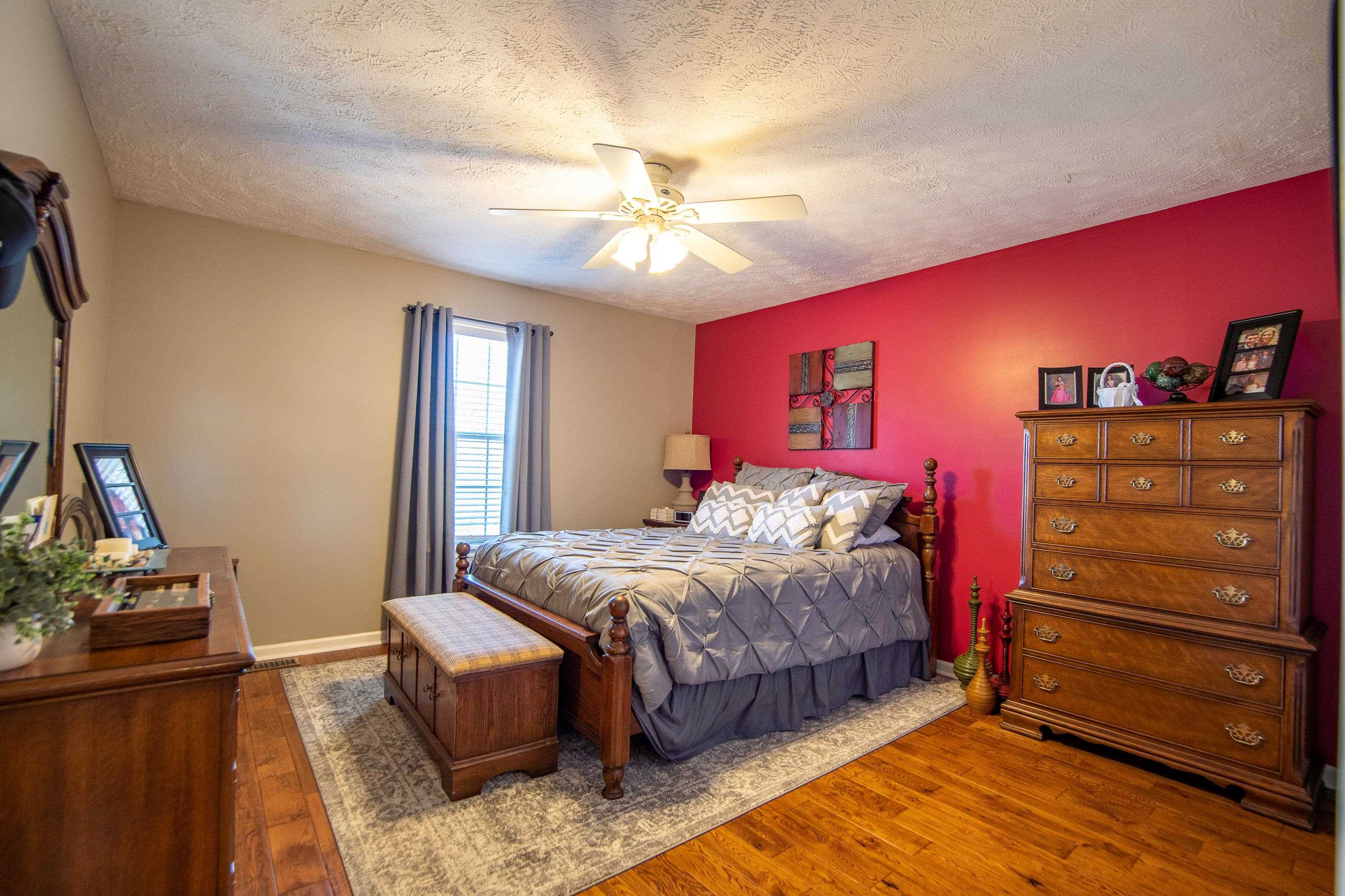 6843 Michie Pebble Hill Road Michie, TN 38357 - Photo 15 of 25 a bedroom with a bed and a dresser