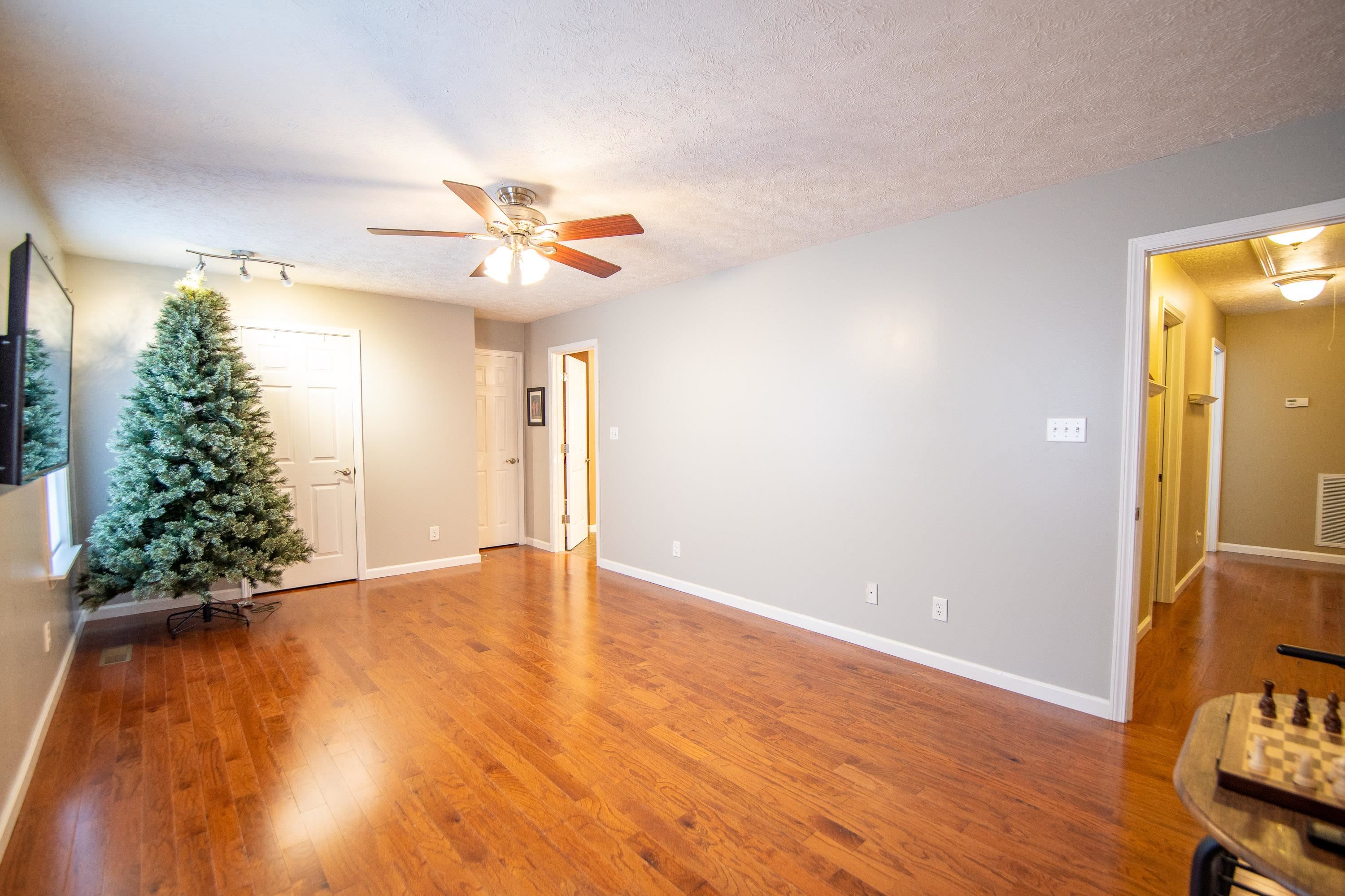 6843 Michie Pebble Hill Road Michie, TN 38357 - Photo 19 of 25 a view of an empty room with window and wooden floor