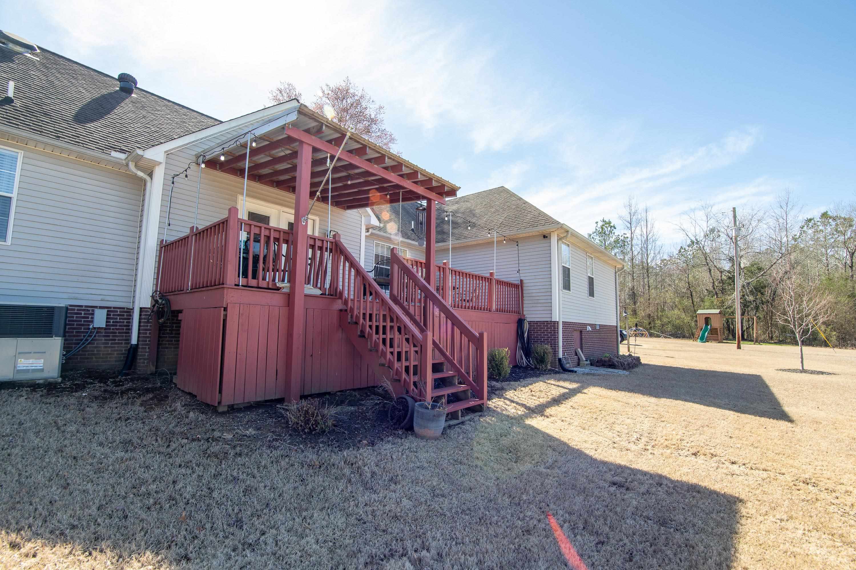 6843 Michie Pebble Hill Road Michie, TN 38357 - Photo 20 of 25 a view of a house with a yard
