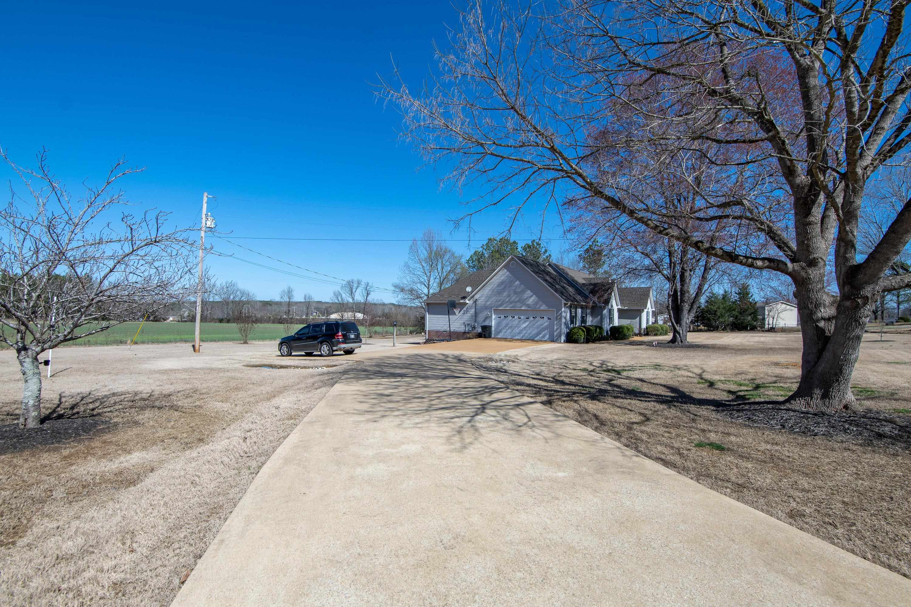 6843 Michie Pebble Hill Road Michie, TN 38357 - Photo 23 of 25 a view of a backyard of a house