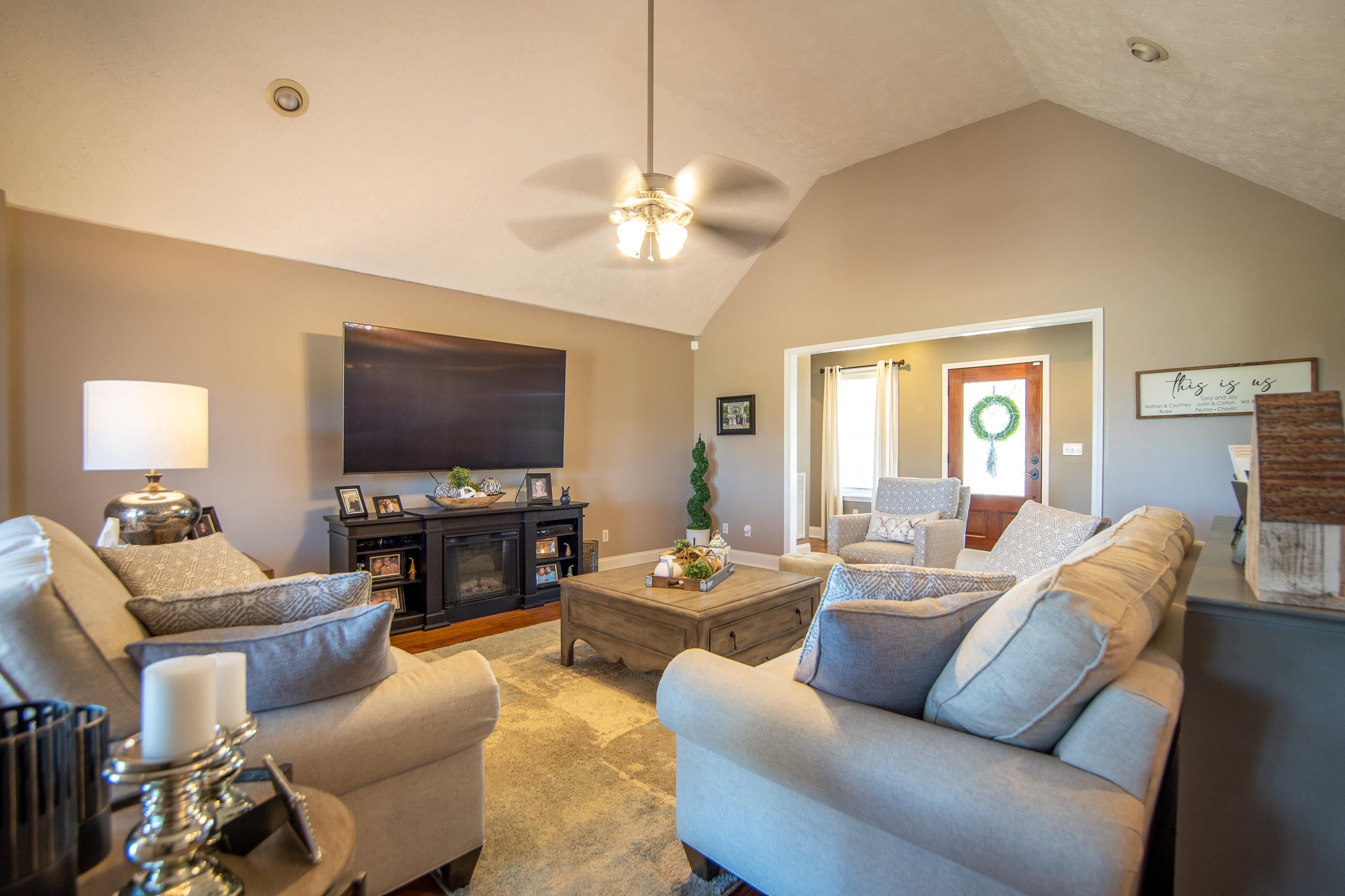 6843 Michie Pebble Hill Road Michie, TN 38357 - Photo 6 of 25 a living room with furniture and a flat screen tv