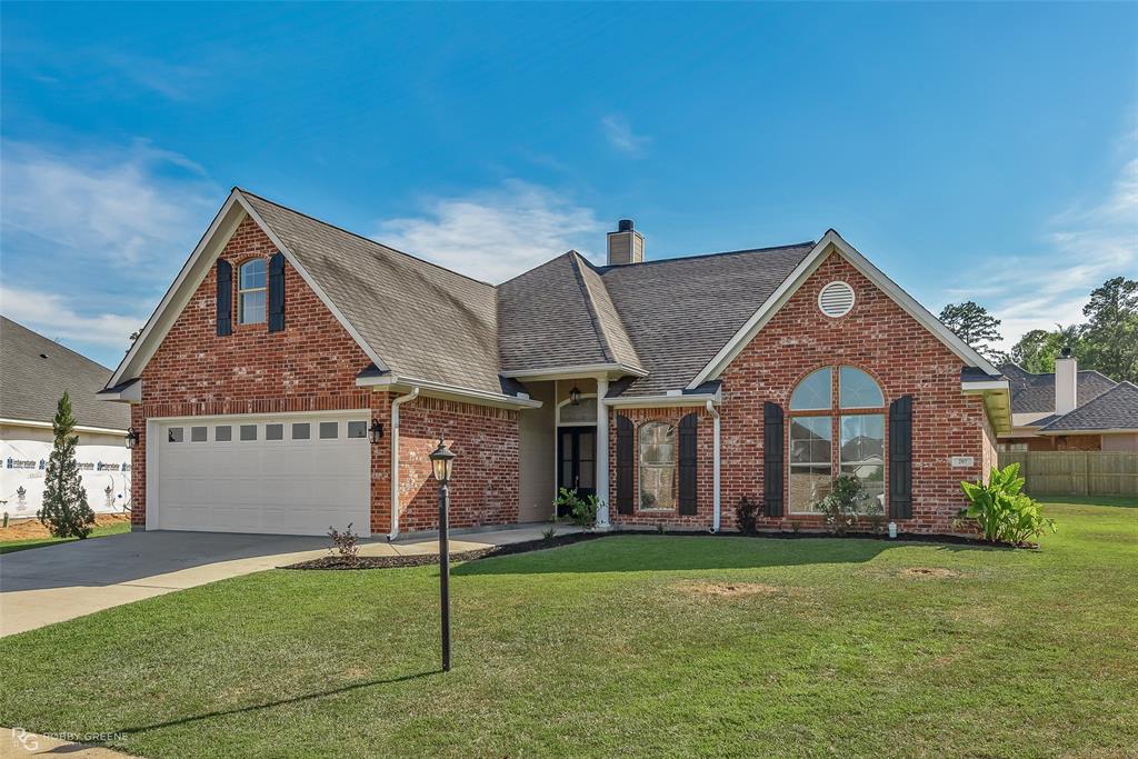 207 Spring Leaf Drive Shreveport, LA 71106 - Photo 1 of 1 a front view of a house with a garden