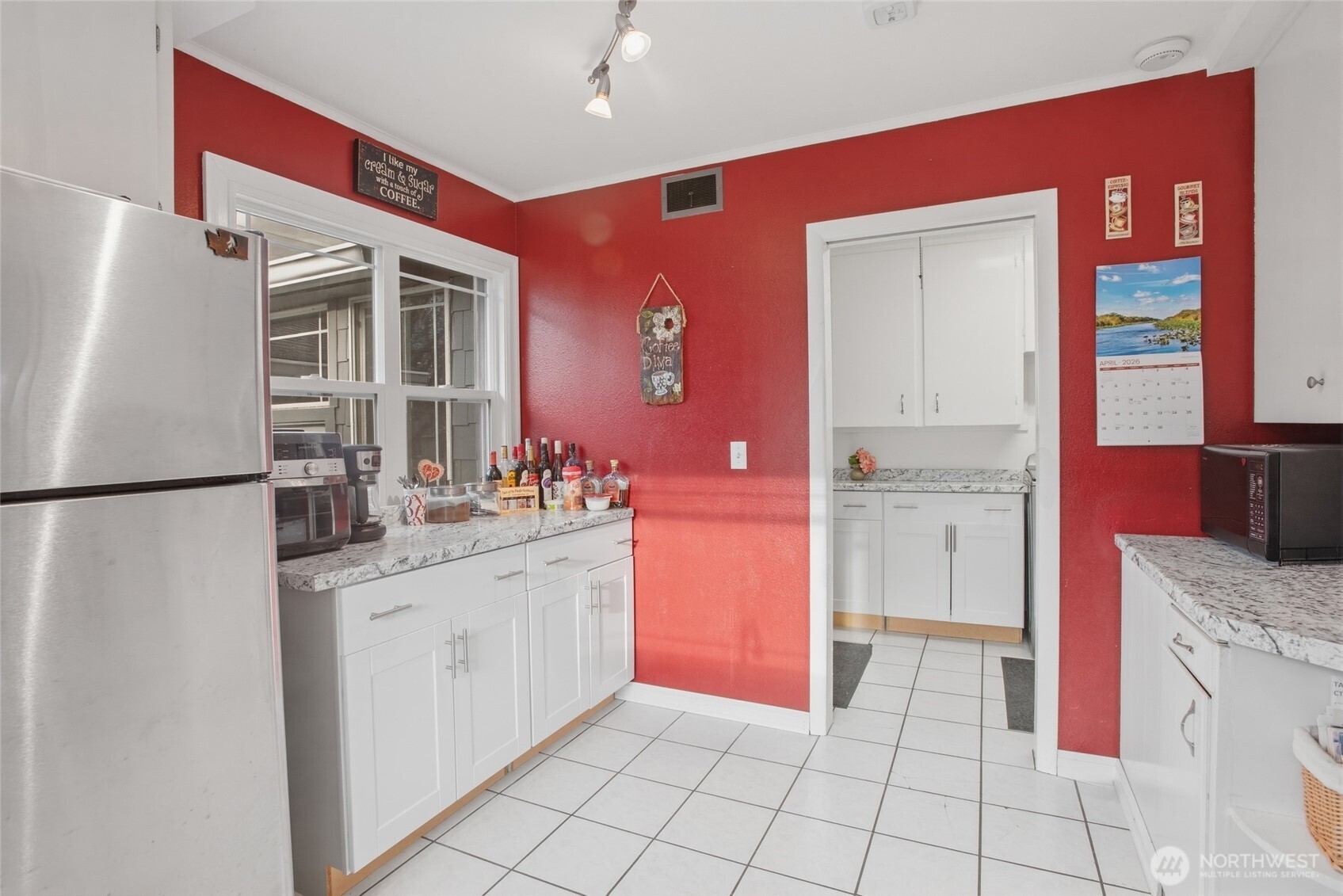 2748 Field Street Longview, WA 98632 - Photo 17 of 39 a kitchen with a sink a refrigerator and cabinets