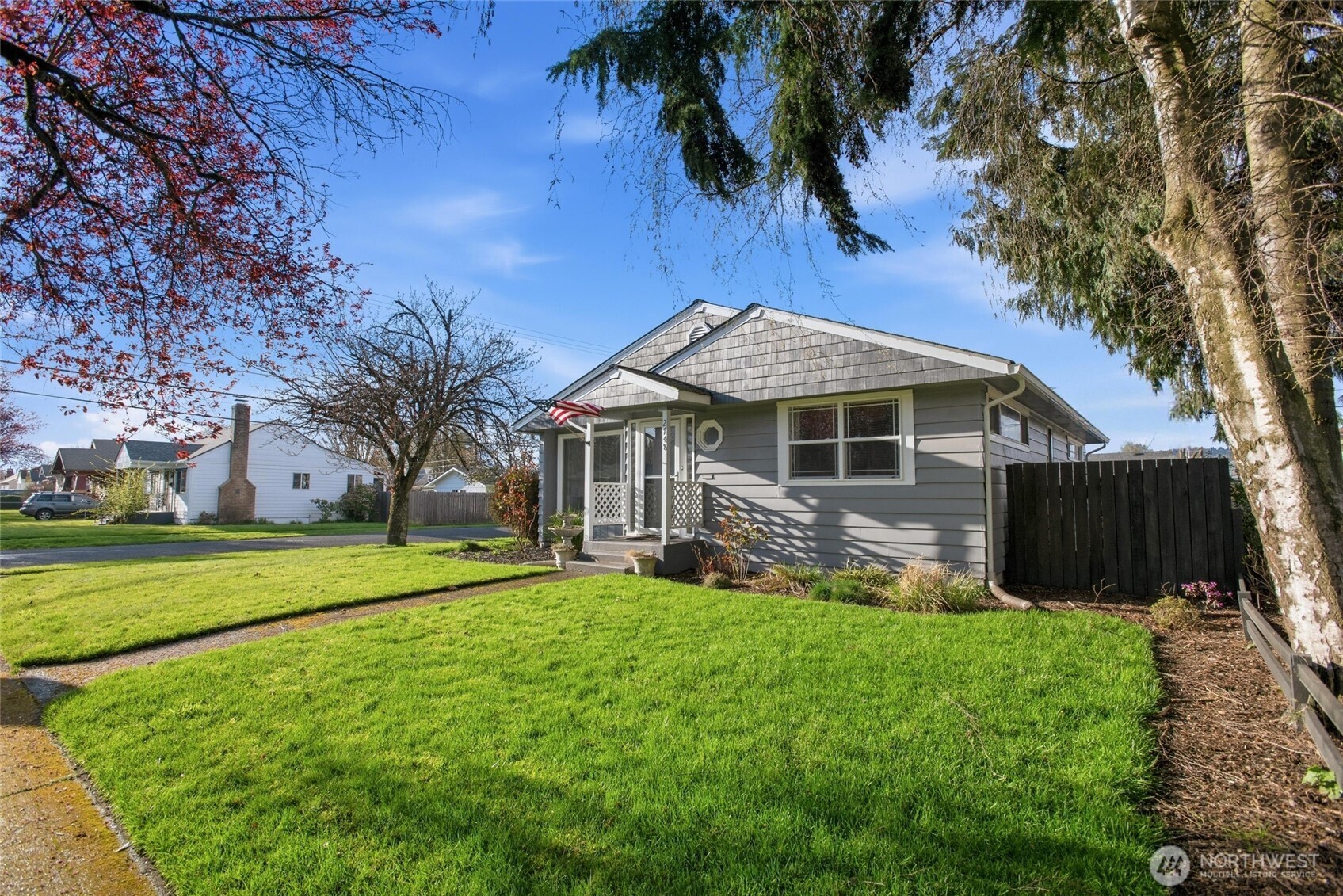 2748 Field Street Longview, WA 98632 - Photo 2 of 39 a front view of a house with a yard and trees