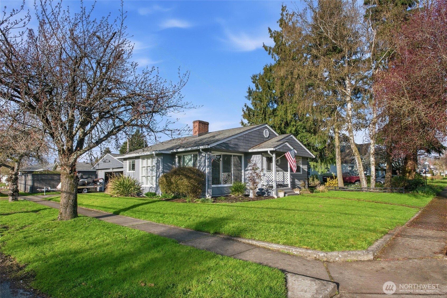 2748 Field Street Longview, WA 98632 - Photo 5 of 39 a front view of a house with a garden and trees