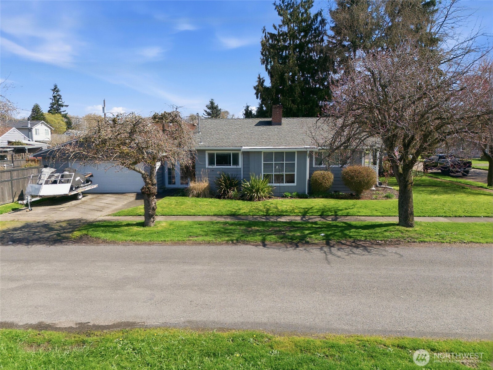 2748 Field Street Longview, WA 98632 - Photo 8 of 39 a front view of a house with a yard and potted plants