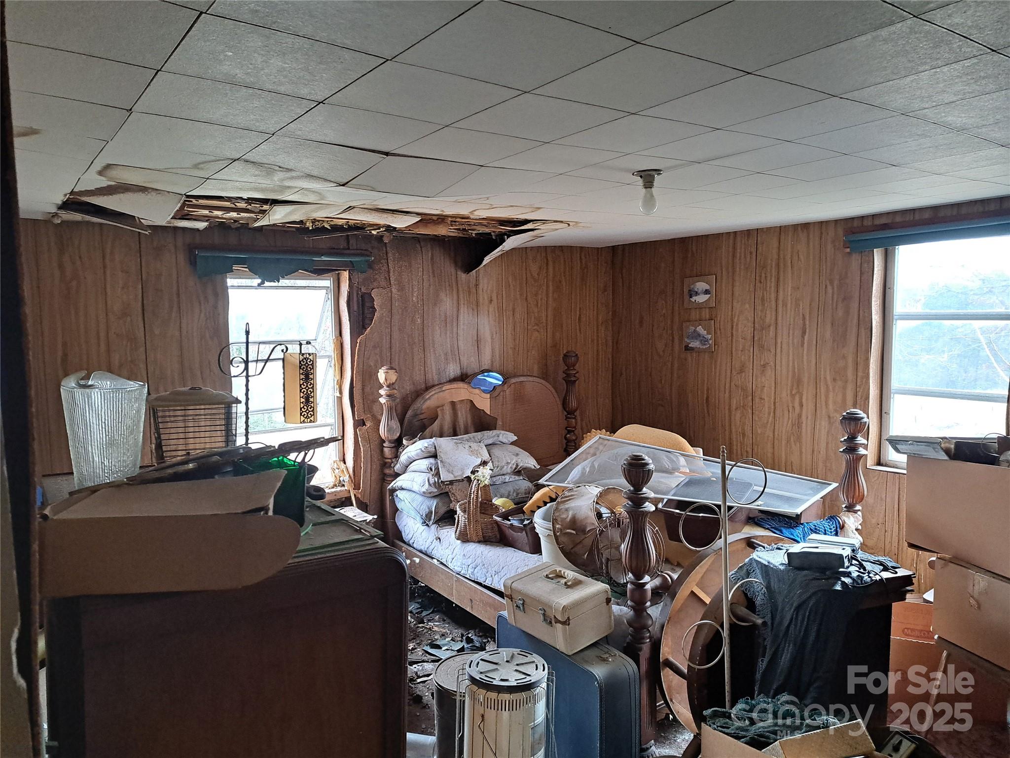 101 Knight Drive Clyde, NC 28721 - Photo 16 of 26 a bed room with furniture and a window