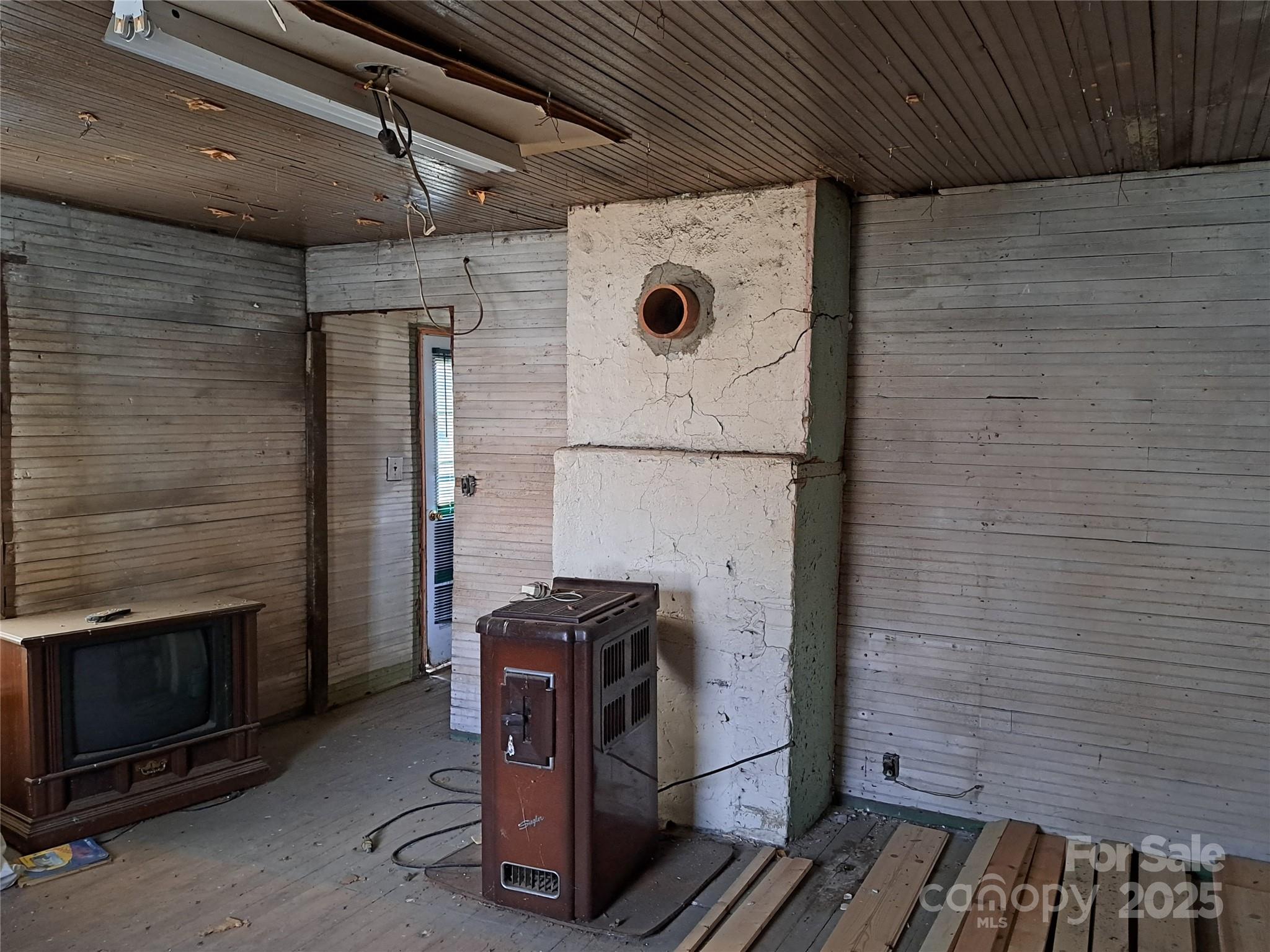 101 Knight Drive Clyde, NC 28721 - Photo 20 of 26 a view of storage and utility room with a washer and dryer