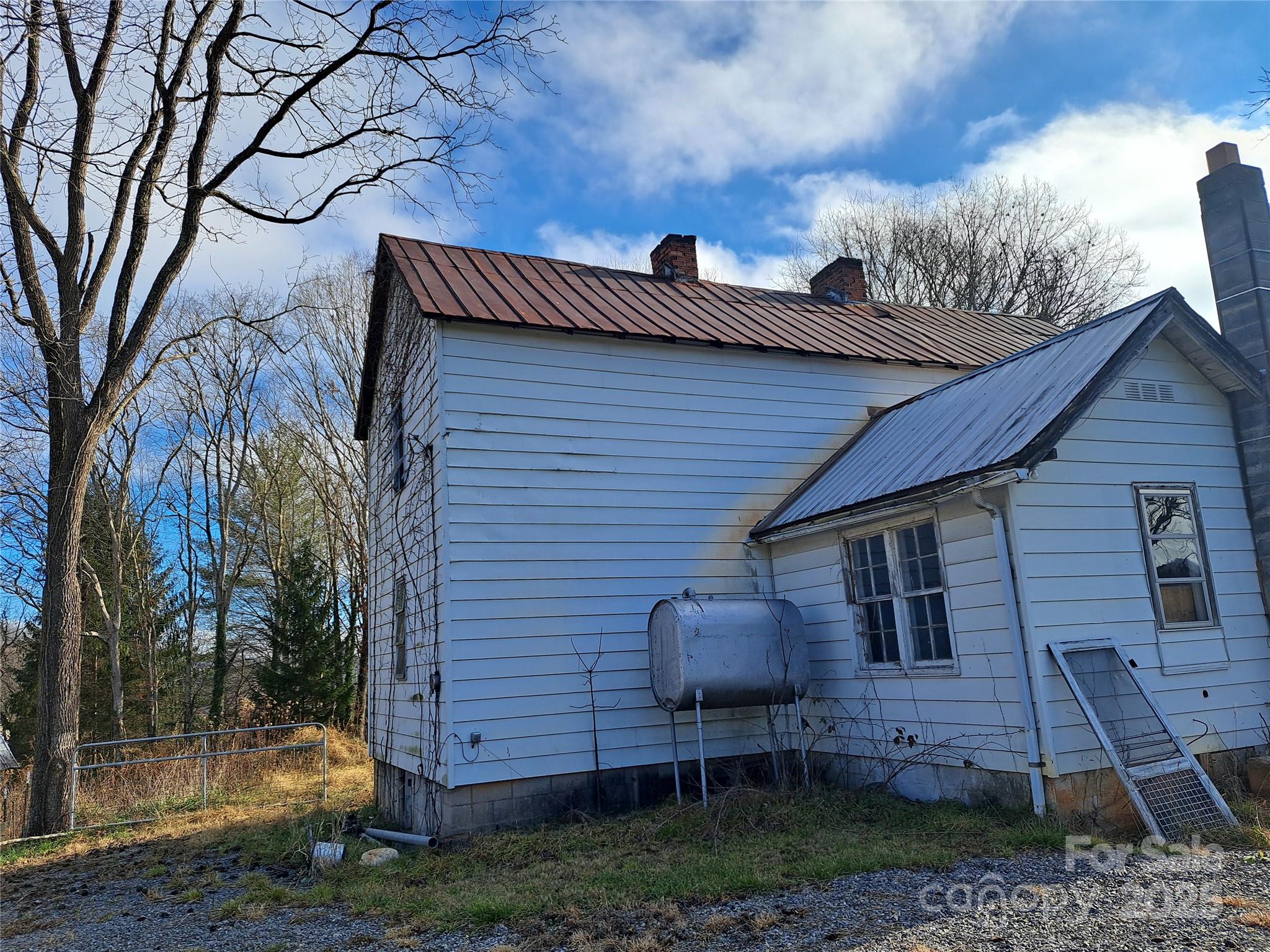 101 Knight Drive Clyde, NC 28721 - Photo 24 of 26 a view of a house with a yard